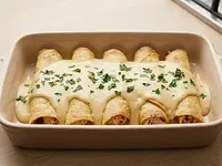 Taquitos de pollo horneados en salsa de queso