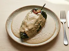 Chiles Rellenos de Tocino y Sesos en Salsa de Avellana